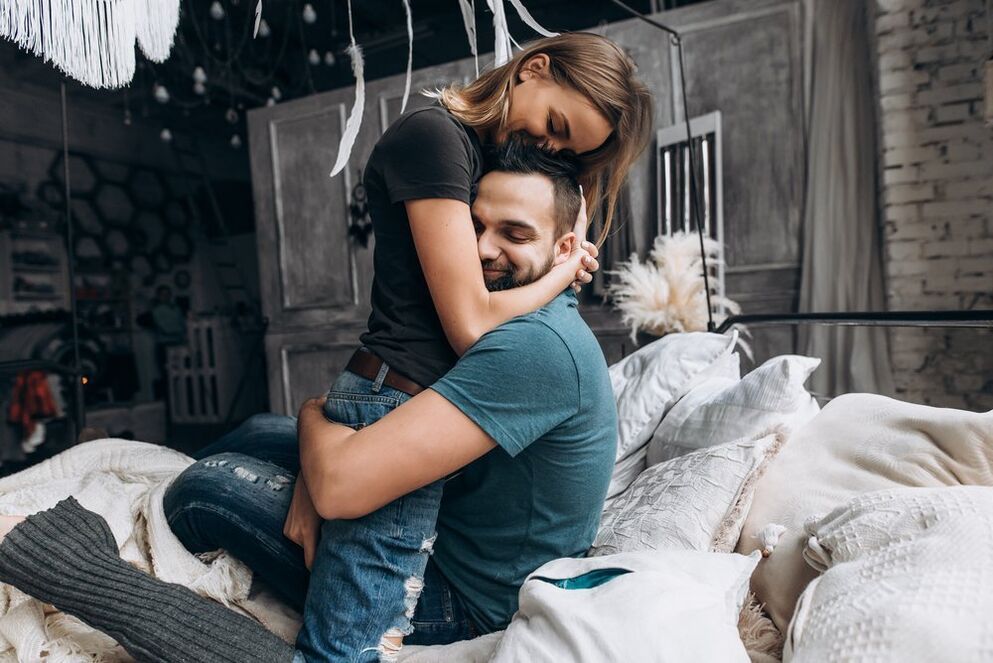 a woman hugging a man who increased activity